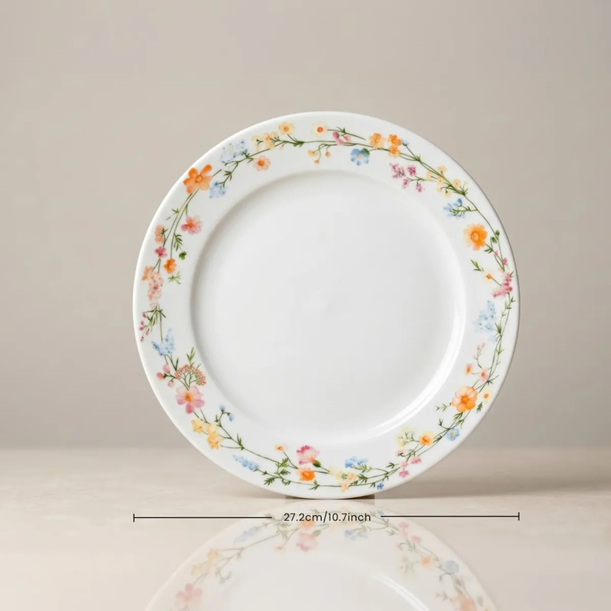 Single white dinner plate with delicate multicolour floral border