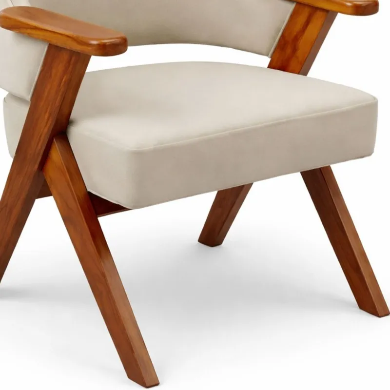 Close-up of beige chair upholstery and polished teak wood legs