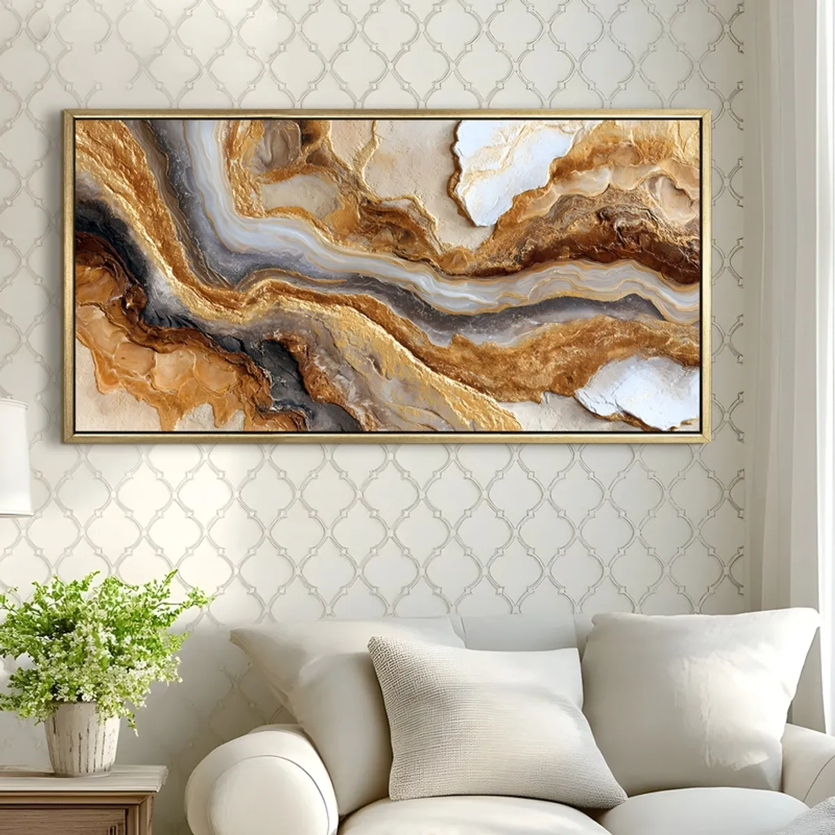 Gold-toned abstract framed canvas painting displayed above a white sofa