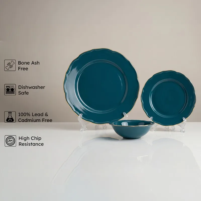Dark teal plate, side plate and bowl with gold rims displayed together