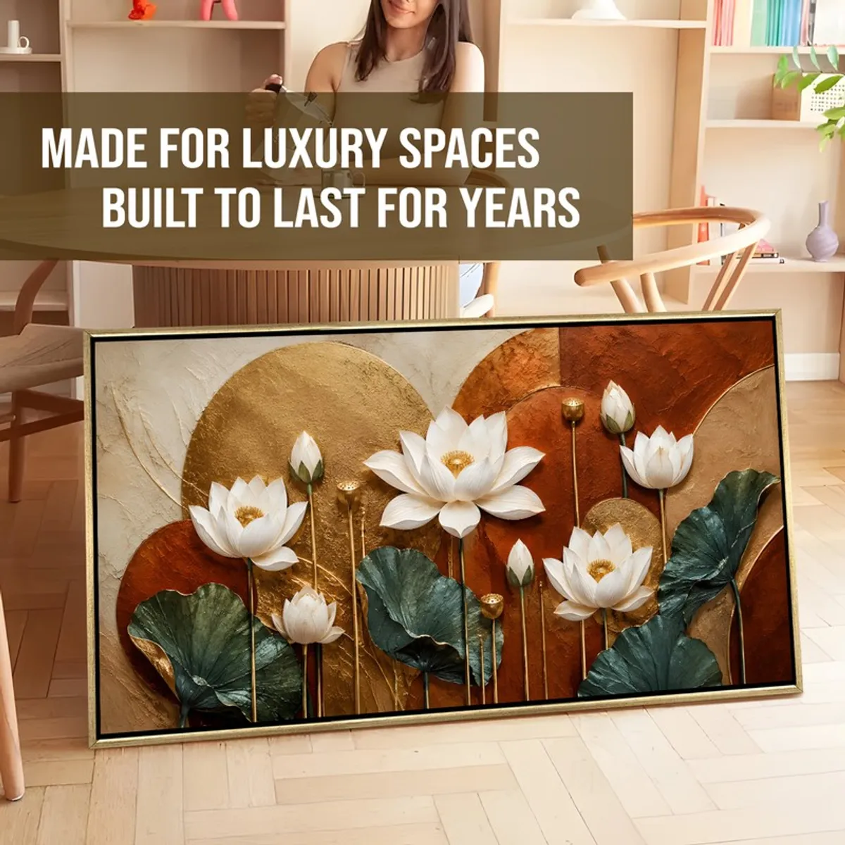 Framed lotus wall painting leaning against the floor in a styled room