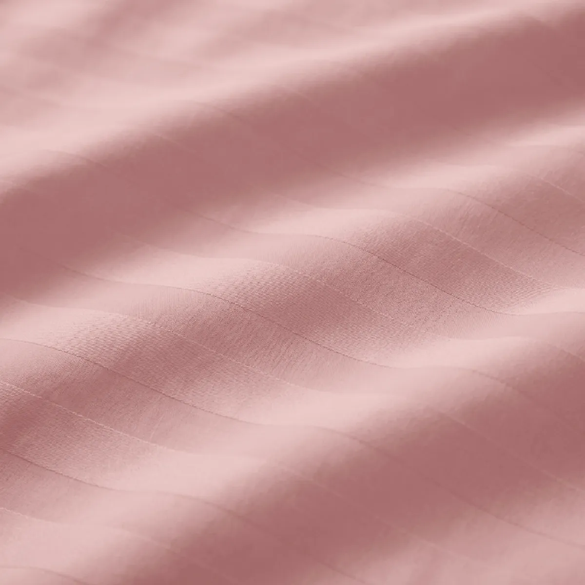 Close-up view showing the soft pink striped fabric surface