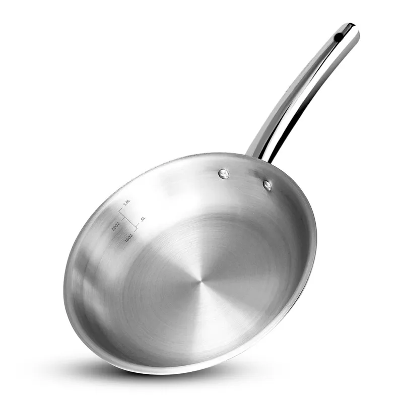 Angled view of the polished silver frying pan interior and handle