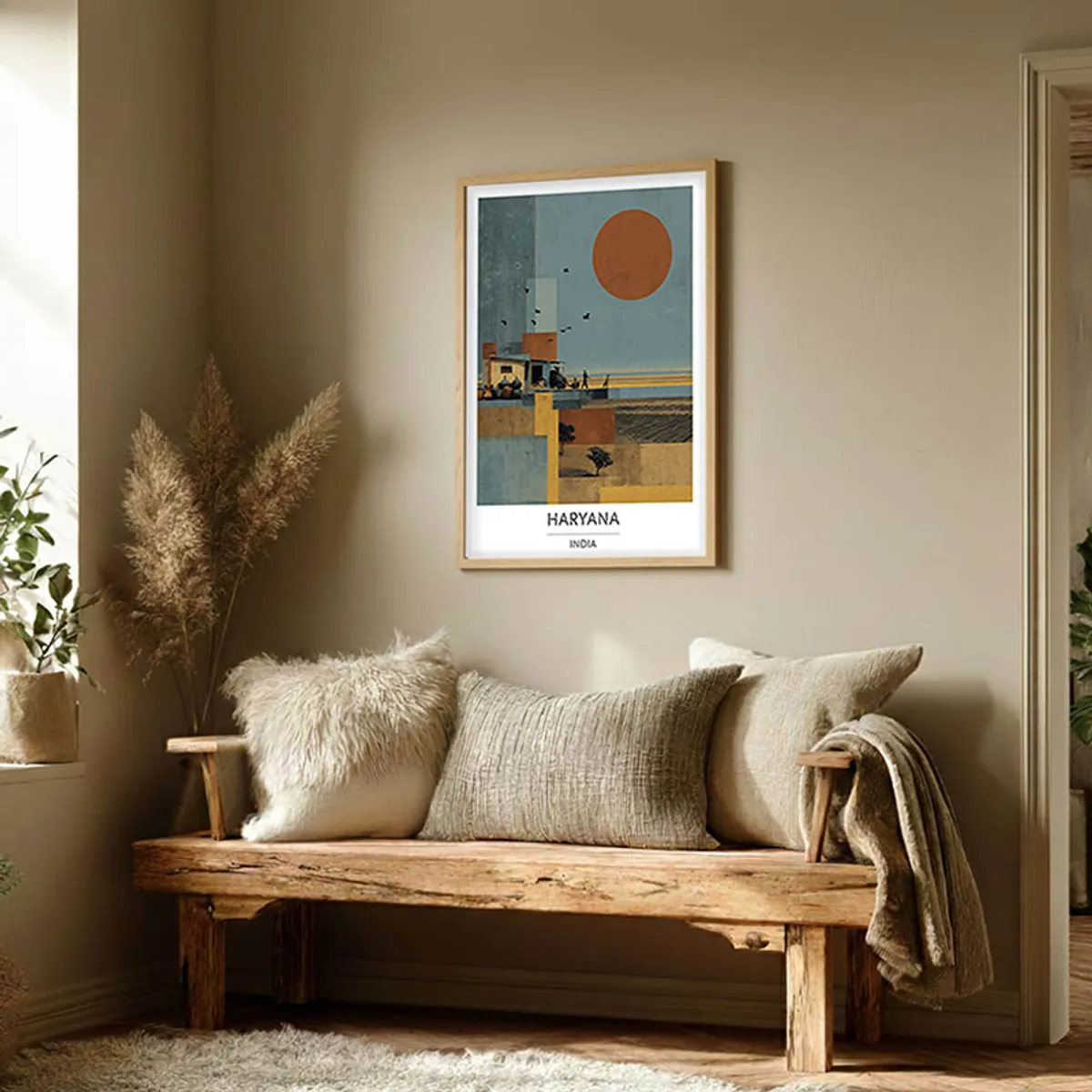 Framed Haryana wall art displayed above a rustic wooden bench