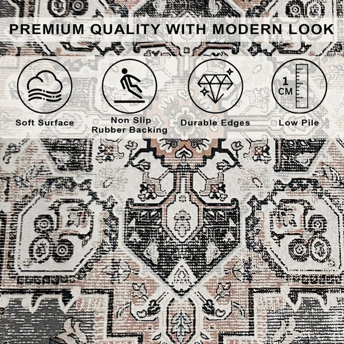 Close-up of the carpet showing its intricate grey, beige and black motif