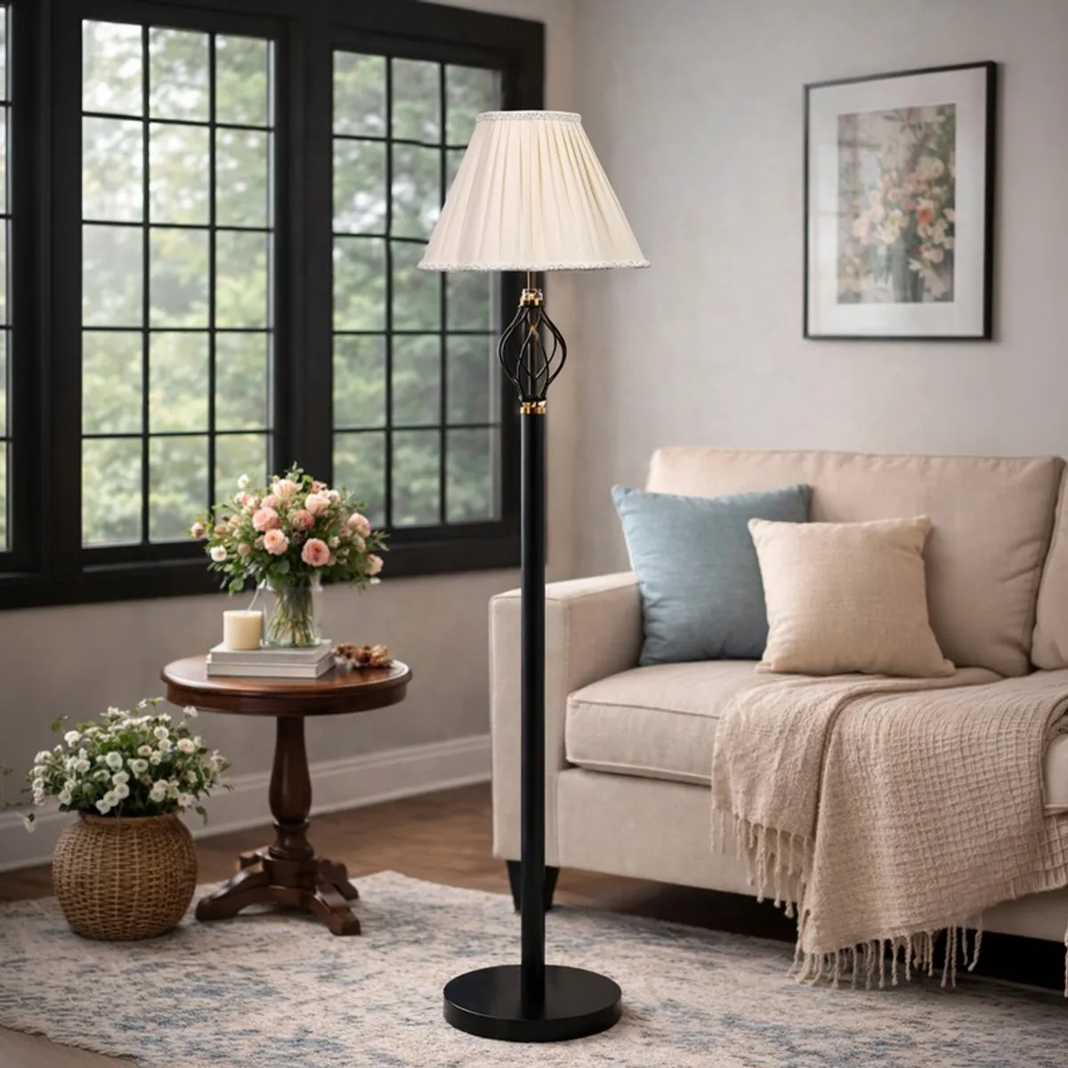 Ivory pleated floor lamp styled beside a sofa and round side table