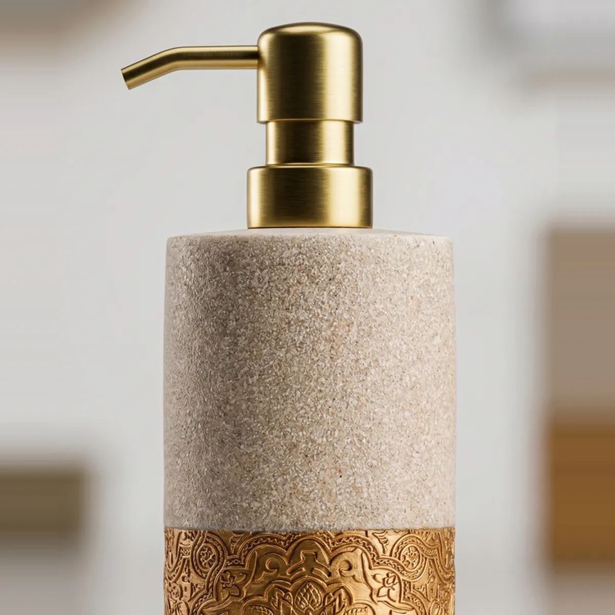 Close-up of the dispenser with gold pump and ornate base