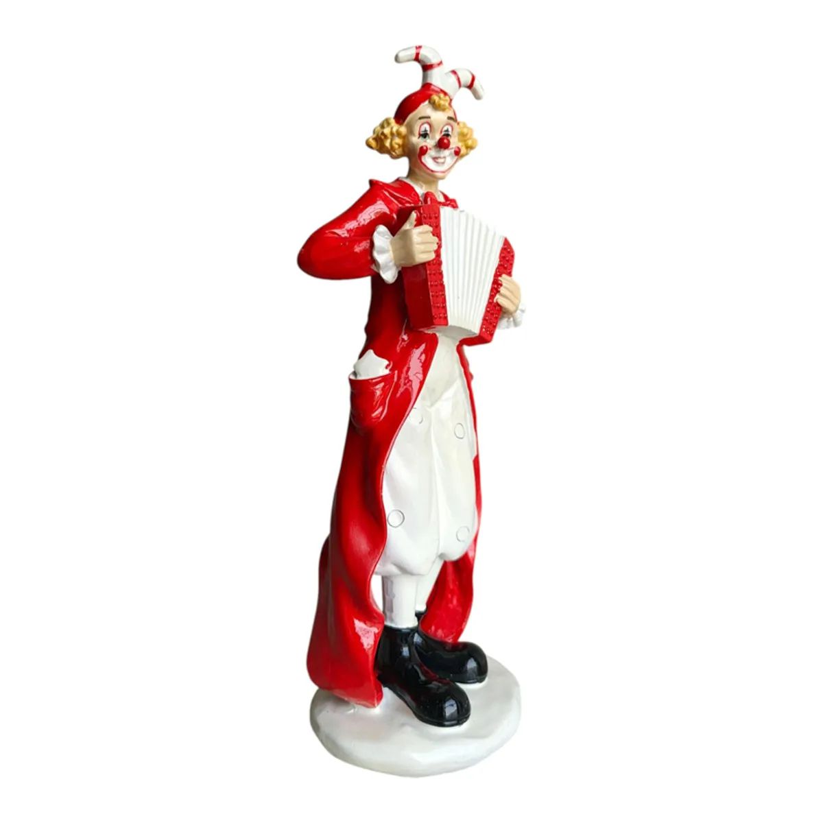 Side view of a red and white accordion-playing clown figurine