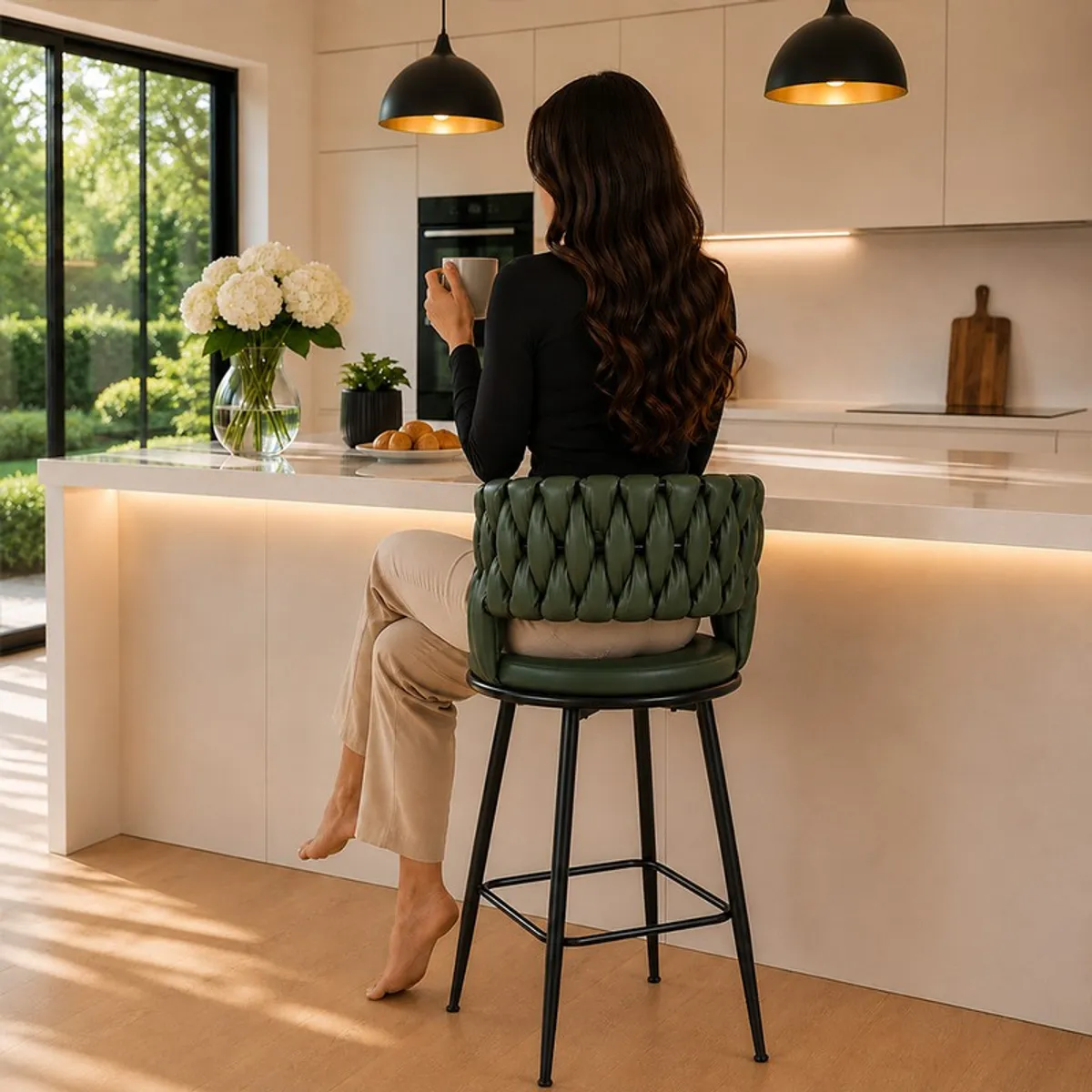 Rear view of a green bar stool with a textured back, seat and black metal frame.