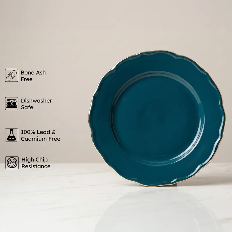Dark teal round dinner plate with a glossy finish and gold rim