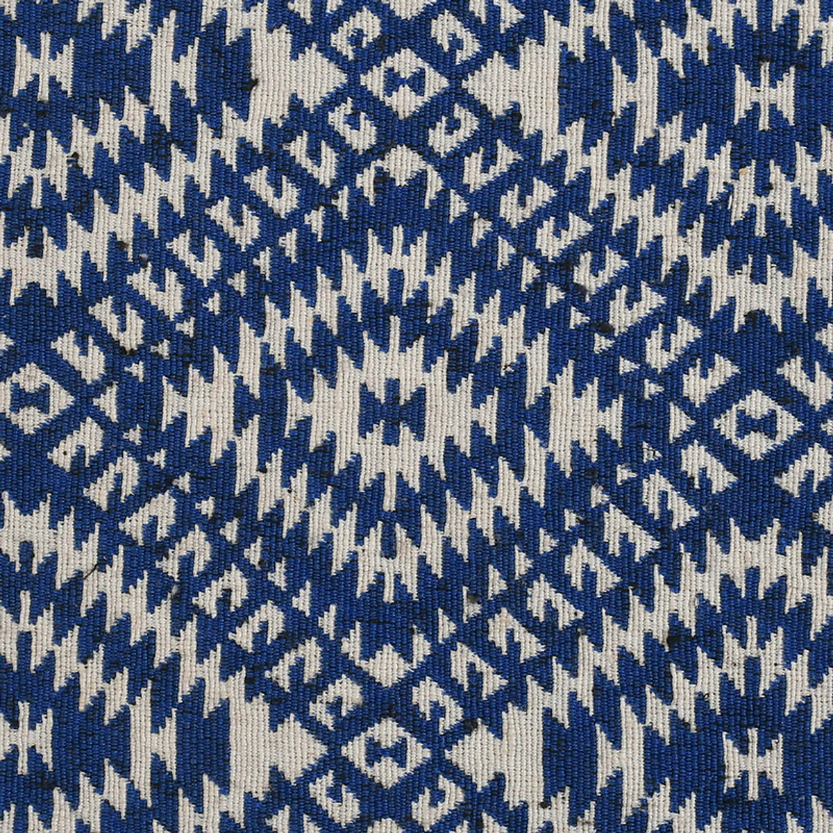 Close-up of the blue and off-white woven geometric pattern