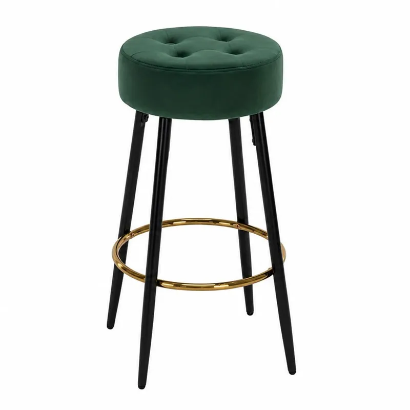 Green round bar stool with black legs and gold circular footrest