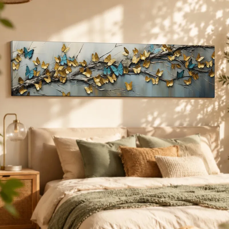 Long butterfly canvas wall art displayed above a softly styled bed