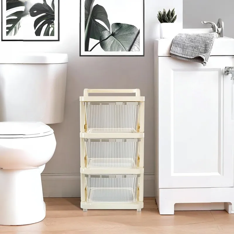 Three-tier white storage rack positioned beside a bathroom vanity