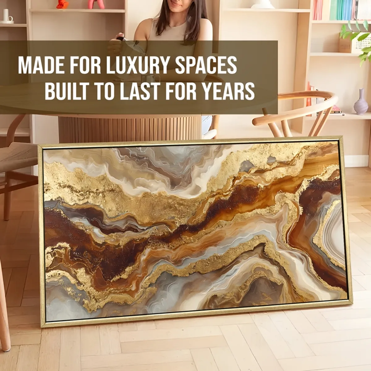 Large rectangular abstract painting with gold and brown fluid pattern leaning indoors