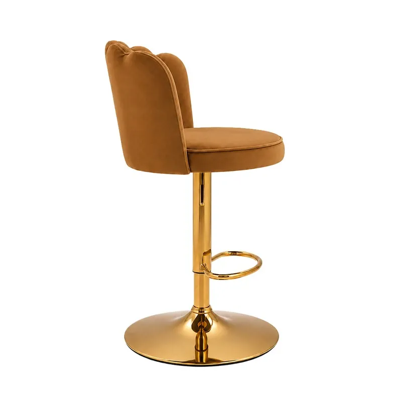 Side view of brown velvet bar chair with round seat and gold-toned footrest