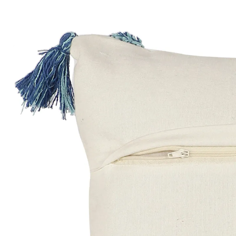 Close-up of a corner tassel and the cushion cover's rear zip closure