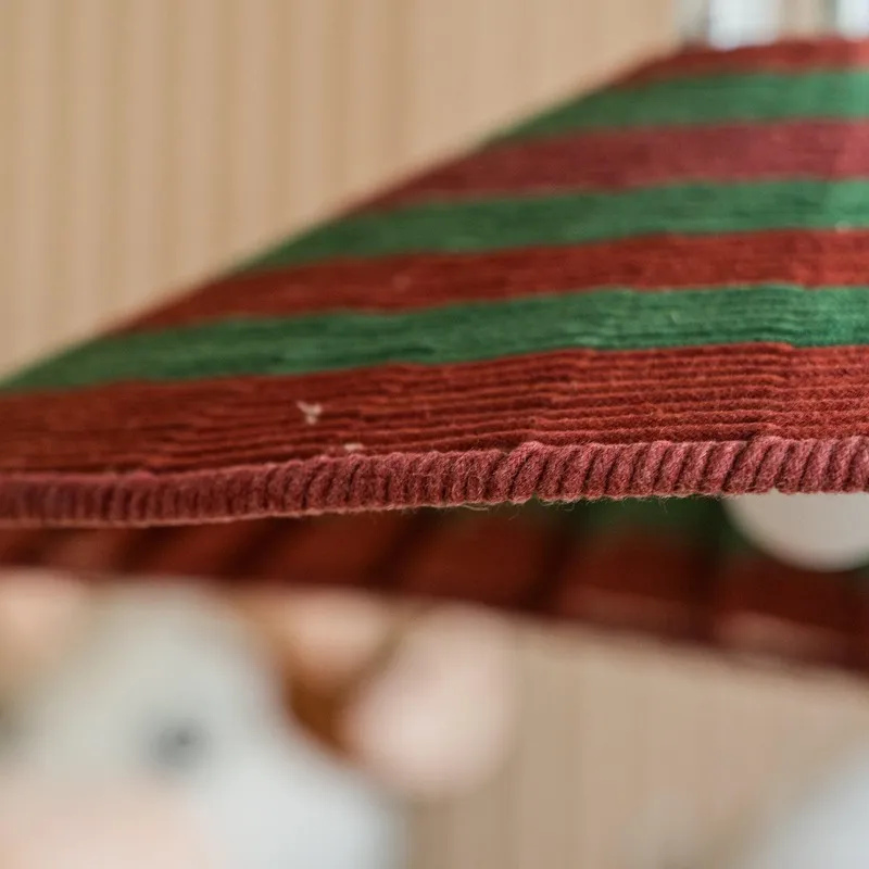 Close-up underside view of the red and green striped lamp shade