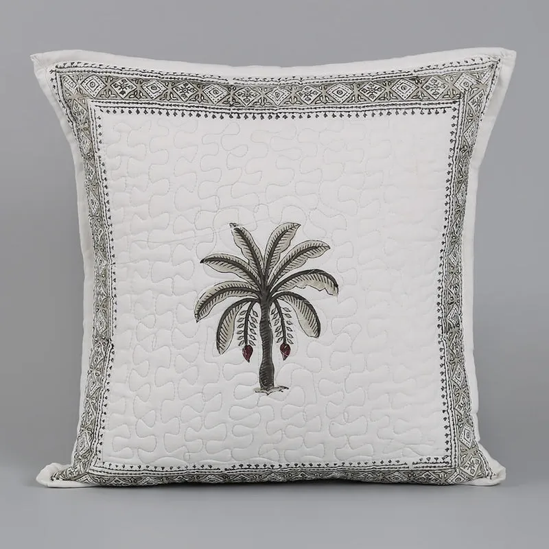 Single white cushion cover with a central palm motif and patterned border.