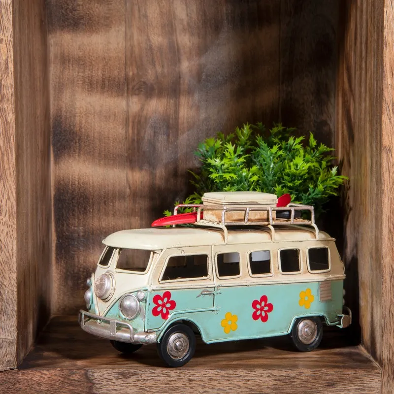 Blue and ivory caravan showpiece with floral motifs displayed on a wooden shelf