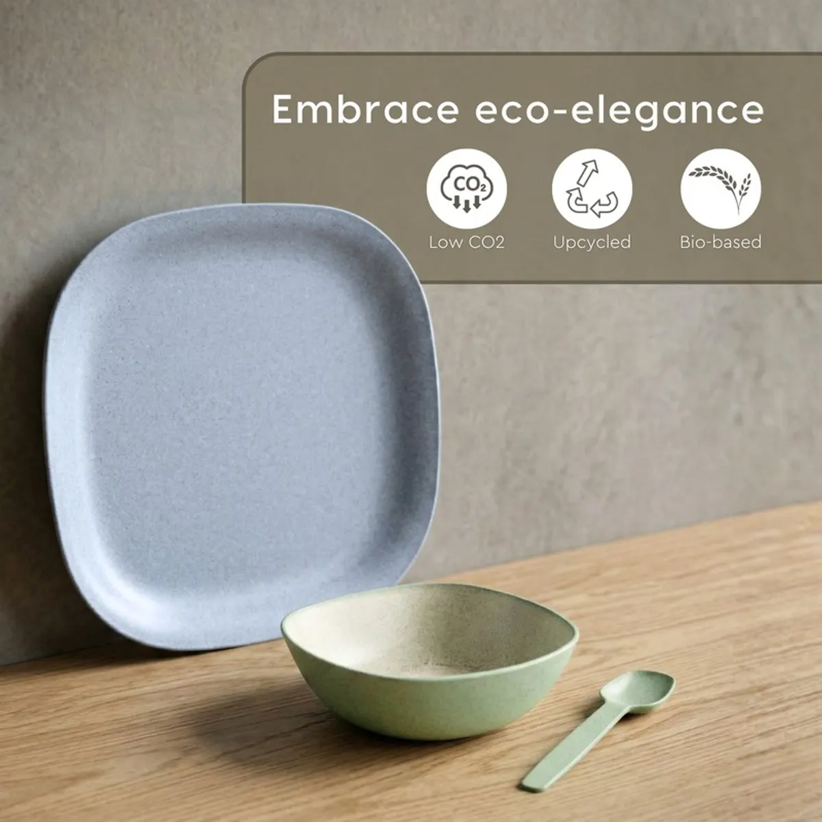 Blue square plate with green bowl and matching spoon on wooden surface