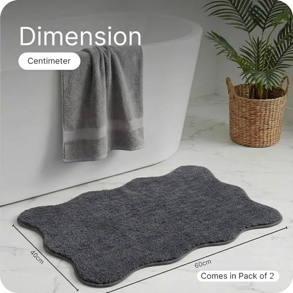 Charcoal grey scalloped-edge bath mat shown with dimension lines in a bathroom