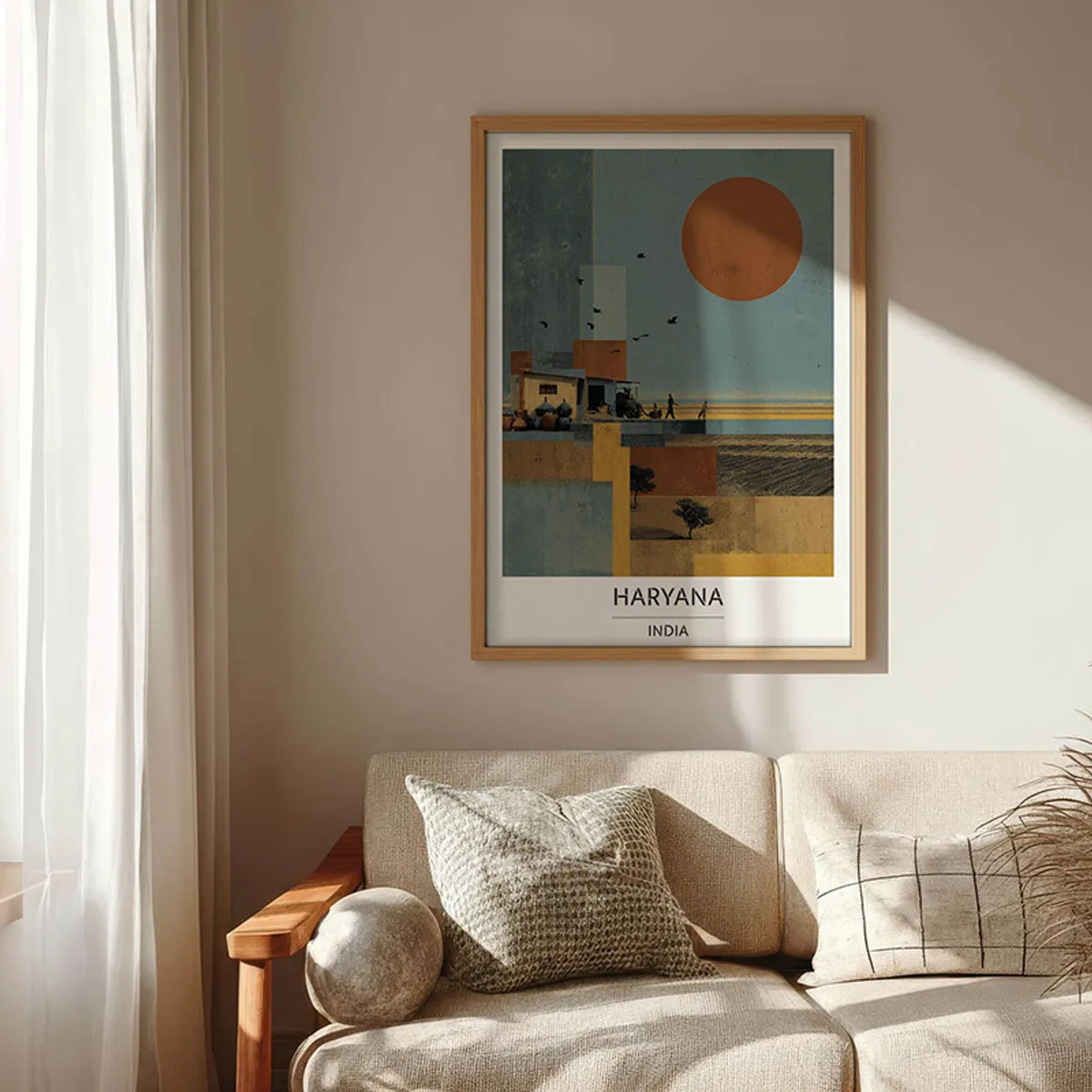 Brown-framed Haryana wall art hung above a light-coloured sofa