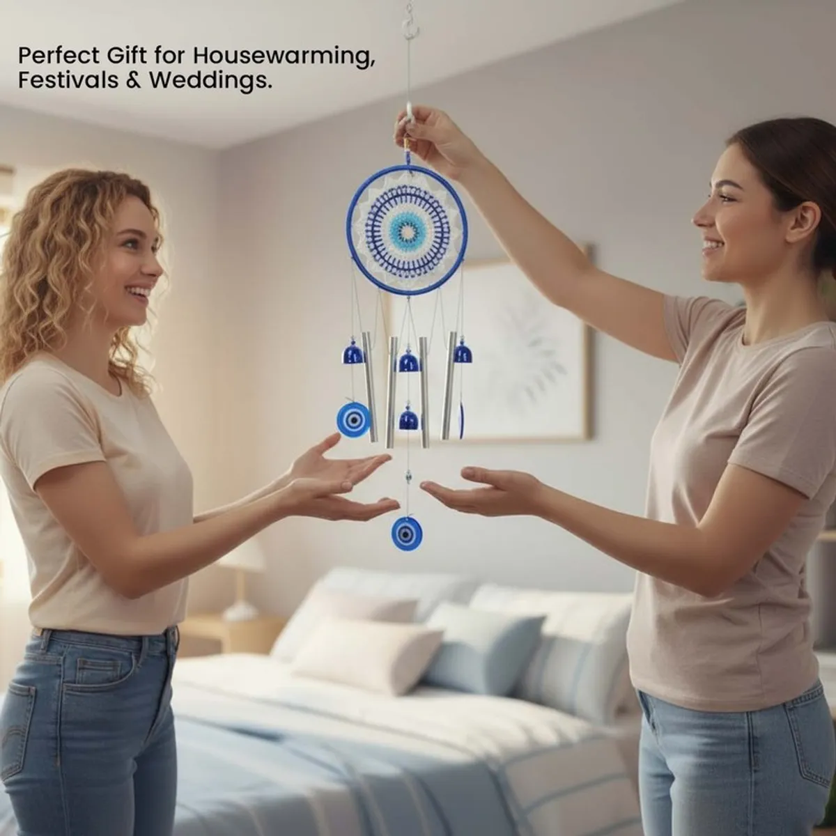 Two people holding the blue wind chime in a bedroom setting