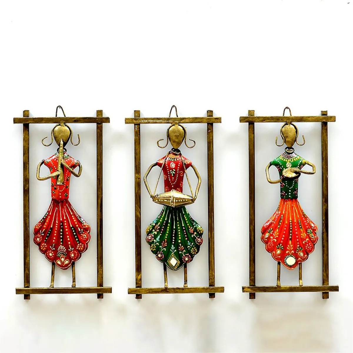 Three framed metal musician wall accents in red, green and orange tones