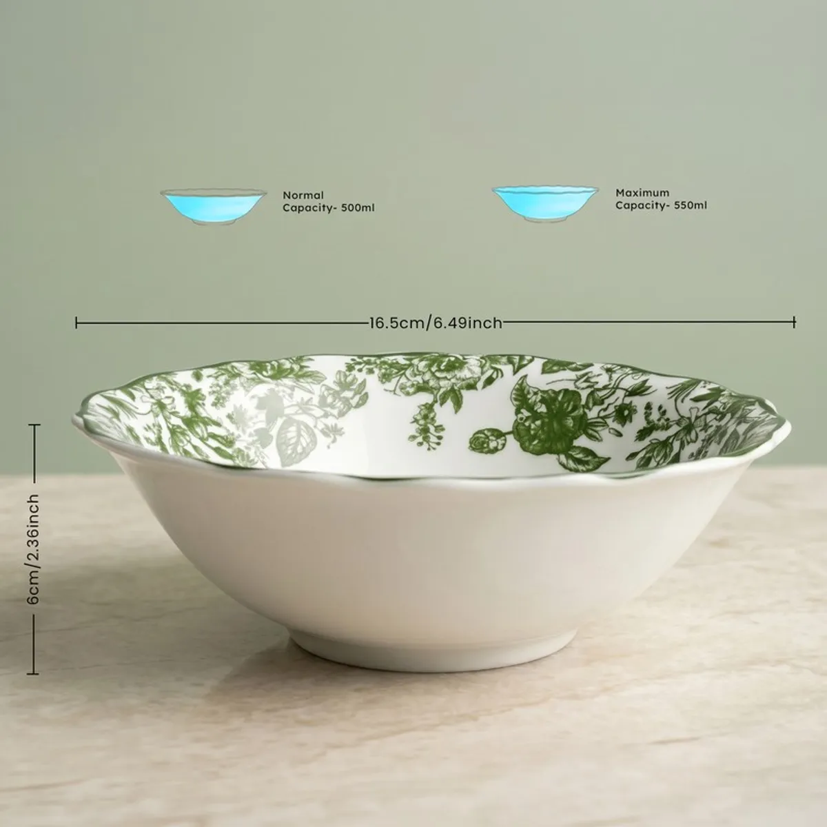 White serving bowl with green floral interior shown from the side