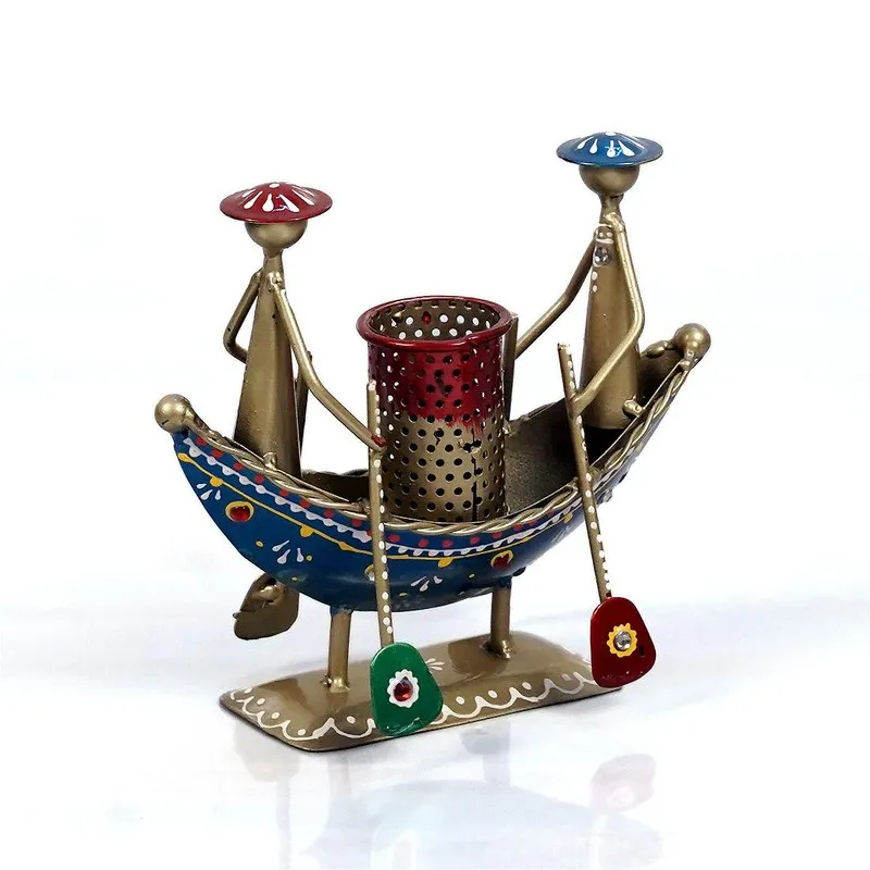 Angled view of hand-painted metal boat pen stand with two figures and oars
