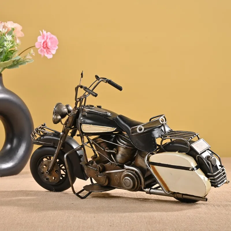 Black and cream vintage motorcycle iron showpiece against a mustard backdrop