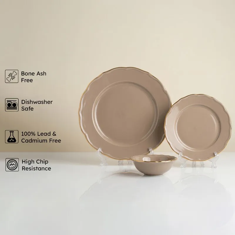 Thunder grey plates and bowl with gold rim displayed on stands