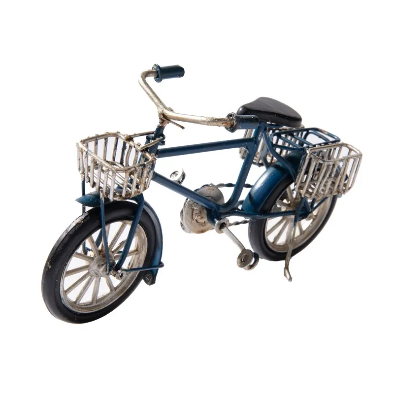 Dark blue bicycle tabletop showpiece with front and rear baskets on white background