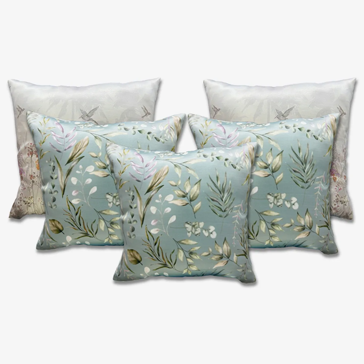 Five square cushion covers displayed together with floral fronts and light backs