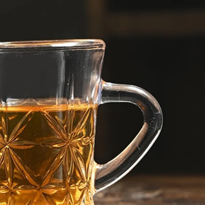 Close-up of a transparent glass tea cup filled with tea