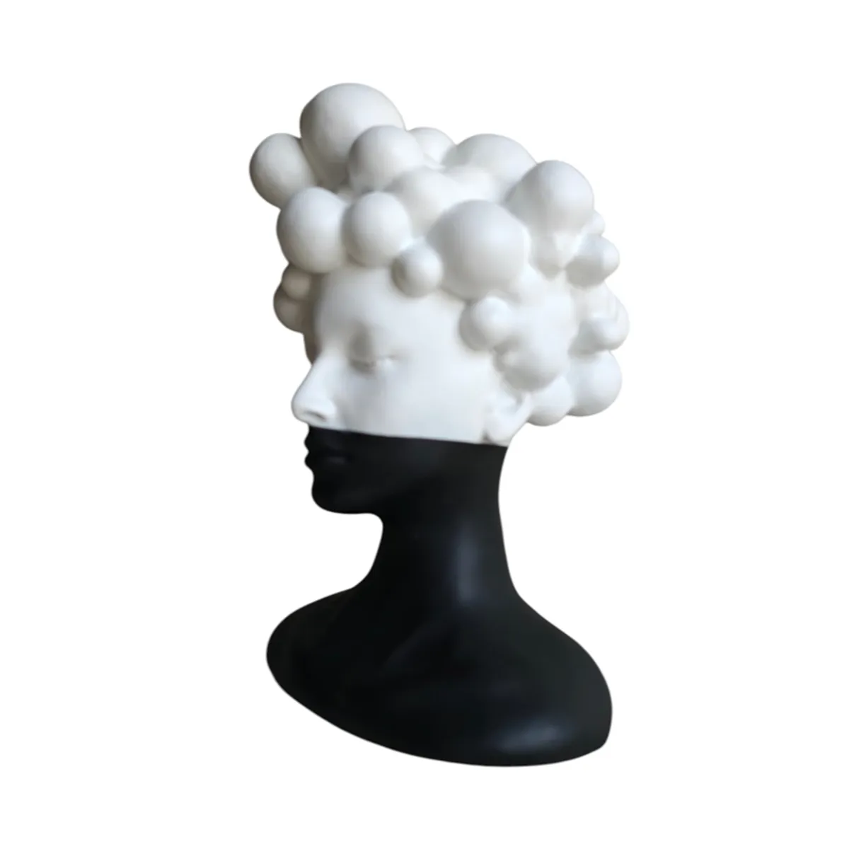 Left-side view of the black-and-white bust showpiece with abstract rounded hair forms