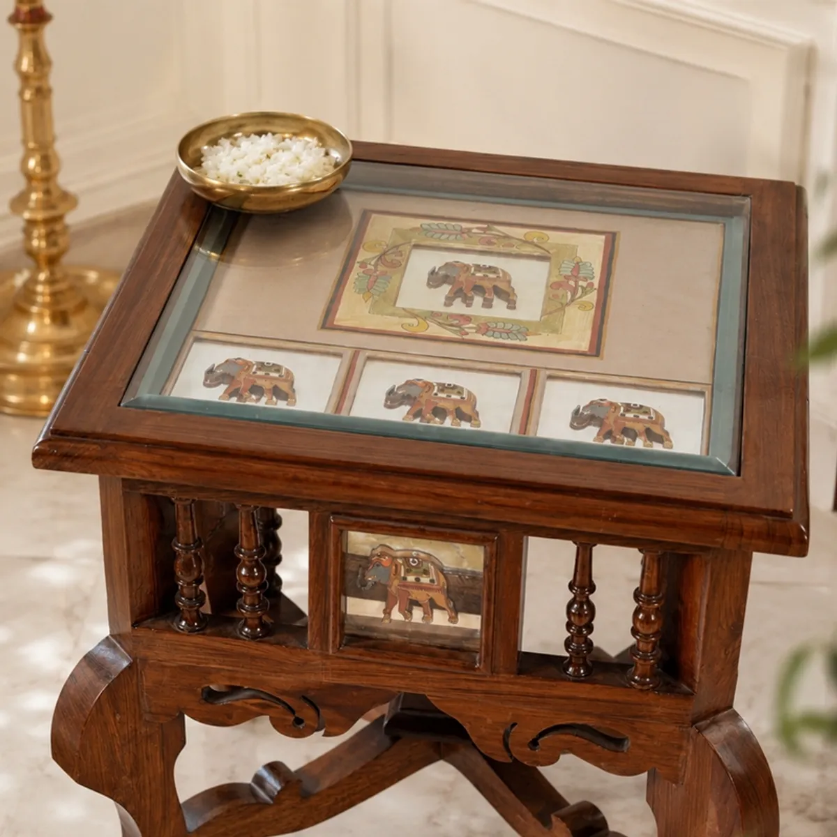 Close view of the square top and brown wooden frame of the side table