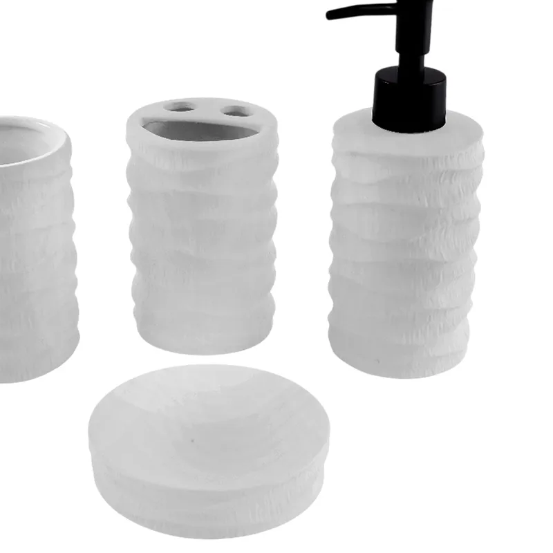 Close view of textured white bathroom accessories with black soap dispenser pump