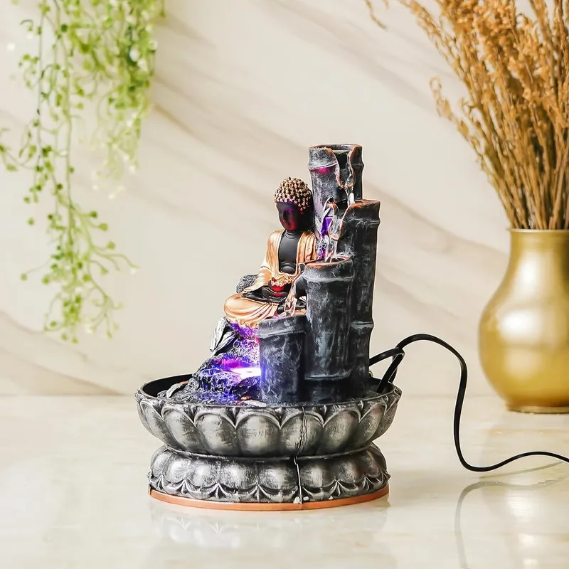 Side view of Buddha LED fountain with tiered water feature and round basin