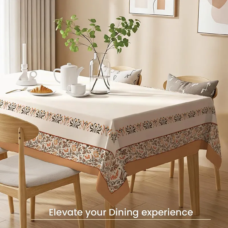 Printed white table cover with floral border styled on a dining table