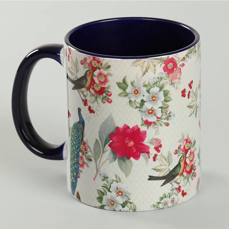 Close angled view of the multicolour bird and flower coffee mug