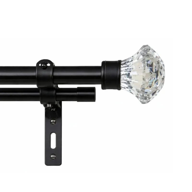 Close-up of black double curtain rod with clear faceted finial