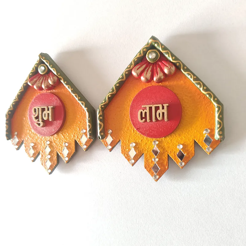 Angled view of handcrafted Shubh and Laabh wall accents