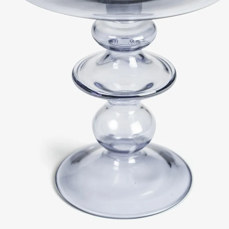 Close-up of the candle holder stem and base in clear glass