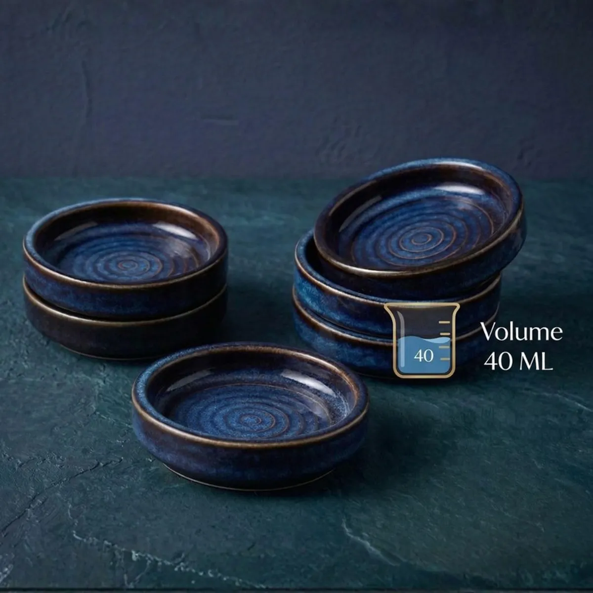 Blue ceramic dip bowls arranged in a group