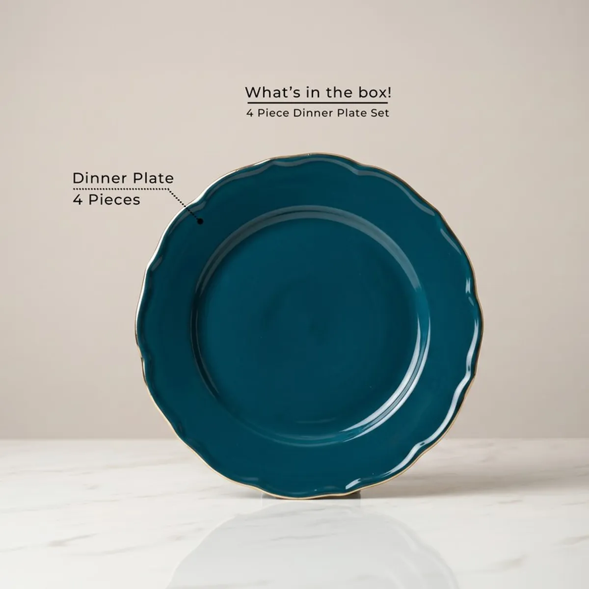 Single dark teal round dinner plate with a gold rim