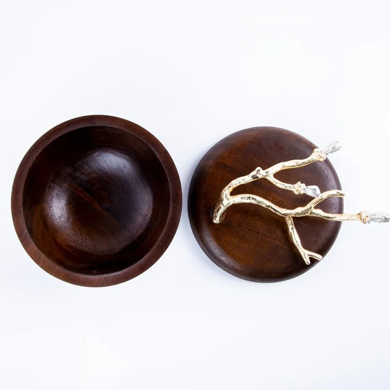 Top view of the open bowl and lid with branch-like ornament