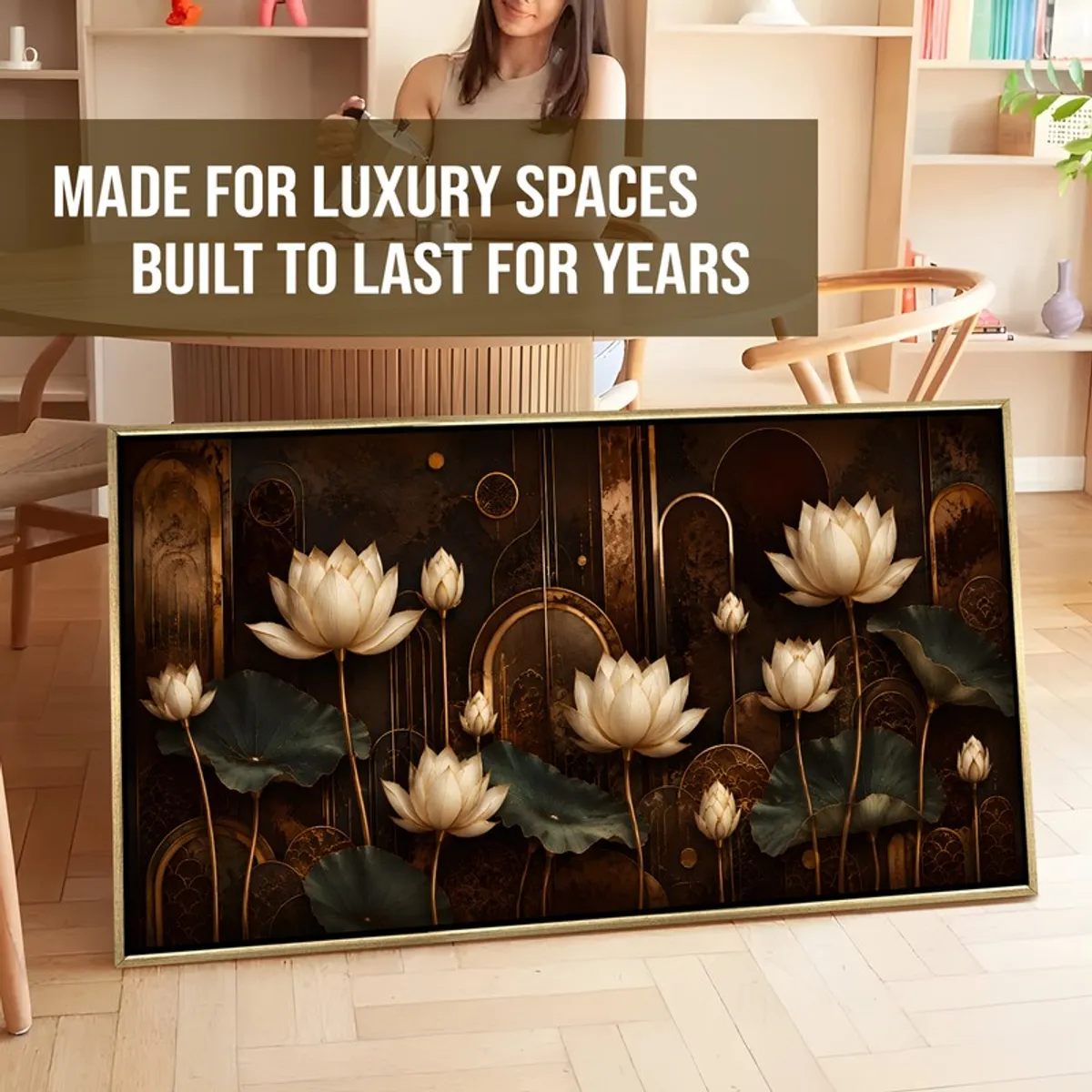 Large framed lotus painting leaning against a wall in a styled interior