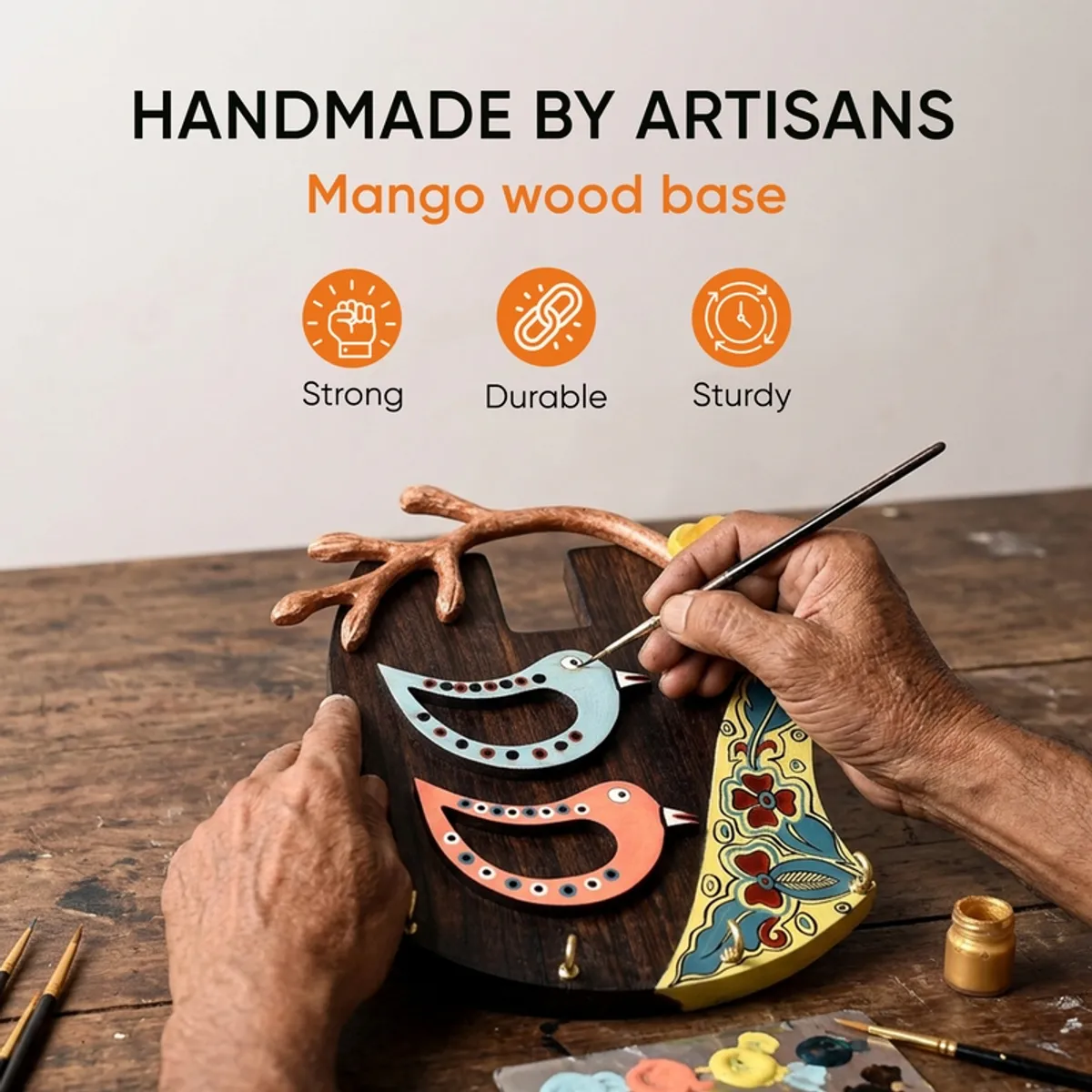 Close view of a wooden bird key holder with colourful painted details